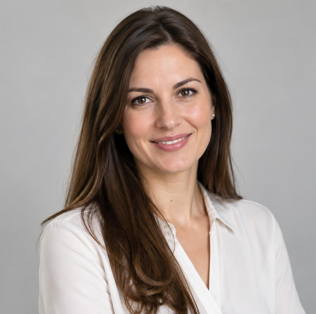 Portrait of a professional woman with long brown hair smiling